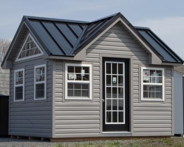 10x12 Custom Victorian Deluxe Storage Shed with vinyl siding, standing seam metal roofing, and additional windows