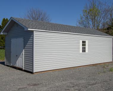 14x28 Front Entry Peak Storage Shed with Harbor Stone Grey Vinyl Siding, White Trim, White Shutters, and a Shingle Roof